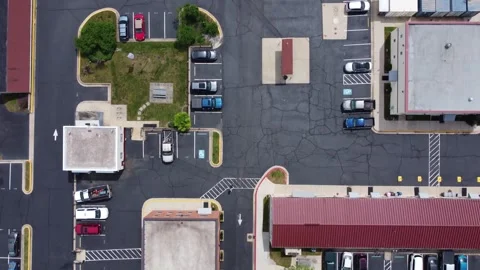 Drone footage looking down at an industrical parking Stock Footage 341284766