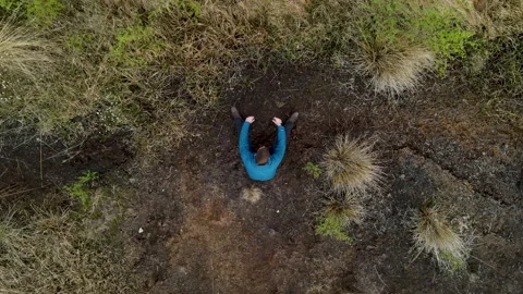 Drone Footage Of Man Then Tilt To Peat Bog, 4K 動画素材 220087341