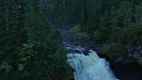 Drone footage of mighty waterfall surging through rock formations Stock Footage 320500746