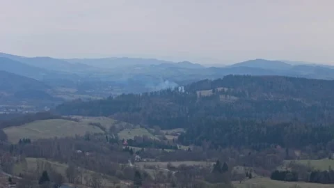 Drone footage of minor forest fire spreading from damaged hunting stand wit.. Stock Footage 333338544