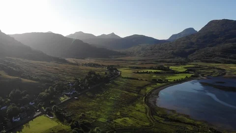 Drone footage of mountains and a lake in Scottish highlands Stock Footage