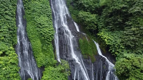 Drone Footage of Multi Stream Waterfall in Lush Bali Forest Stockbeeldmateriaal 332697059