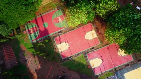 Drone Footage of Multiple Basketball Courts with Players Stock Footage 345551085