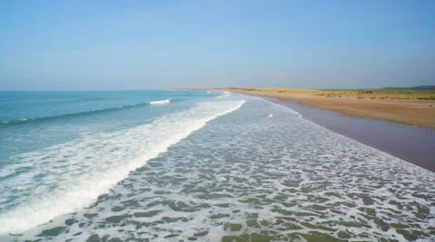 Drone footage of ocean waves reaching beach Stock Footage 50169172
