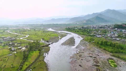 Drone footage offering a panoramic view of Poonch bridge with the flowing river Stock Footage 311793568