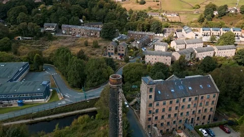 Drone footage of a old mill chimney stack, With footage rotating around Video stock 217422076