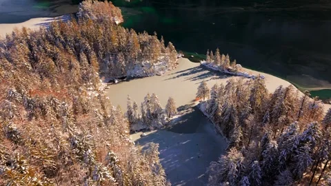 Drone footage over Eibsee and Braxeninsel in winter. Nestled in the Wetterstein Stock Footage 316627323