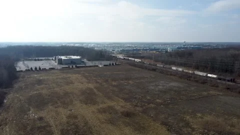 Drone footage over moving train in rural Michigan Stock Footage 275628682