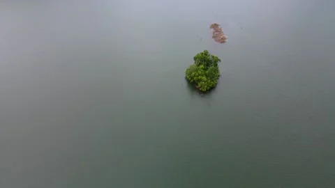 Drone footage over the tiny island Stock Footage 168888104