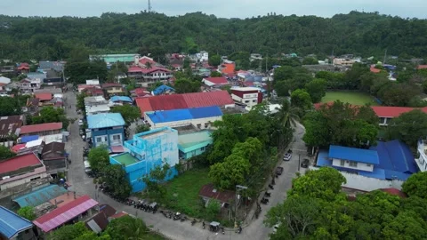 Drone footage over the town proper of Ragay, Camarines Sur, showcasing local 動画素材 345970040