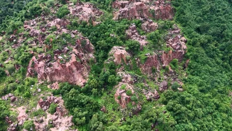 Drone Footage Over Vegetated Mining Hill with Rock Exposures Видео 329355492