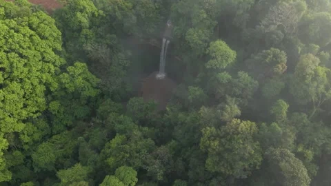 Drone footage over a waterfall in the middle of the forest. 4K. Aerial. Stock Footage 332259692