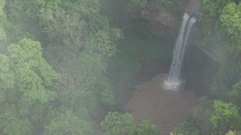 Drone footage over a waterfall with mist in the forest. Aerial. Stock Footage 332259698