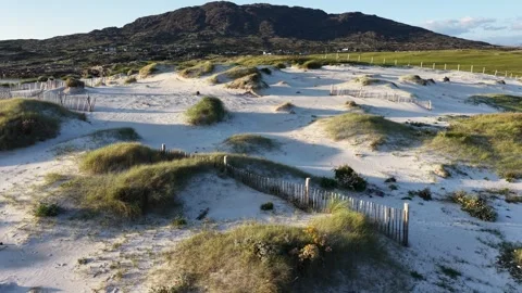 Drone footage over the white sandy dunes of Dog’s Bay Beach, Ireland Stock Footage 343940286