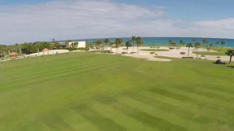 Drone footage overlooking Beach-side Golf Course on Sunny Day Stock Footage 181610492