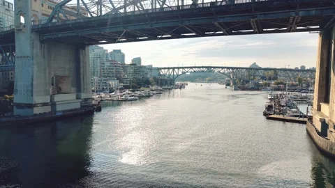 Drone Footage of a Paddleboarder Beneath a False Creek Bridge Stock-Footage 345983810