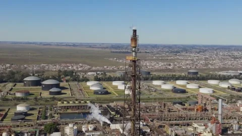 Drone footage of refinery flare stack and storage tanks, Argentina Video stock 316214268