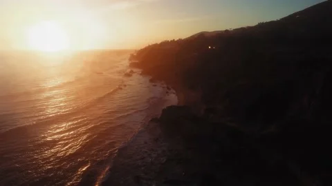Drone footage of rippling ocean surface and the shore at El Matador Beach Stock Footage 137407714