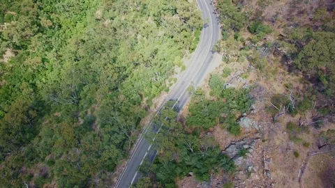 Drone footage of road through forest Stock Footage 94097059