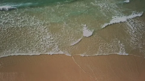 Drone footage of rolling surf Stock Footage 94048630