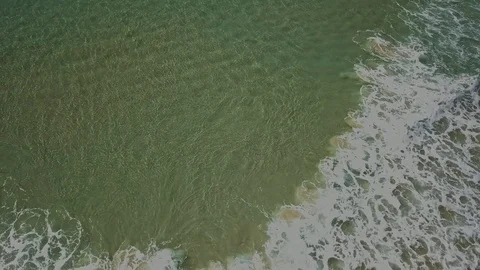Drone footage of rolling surf Stock Footage 94048665