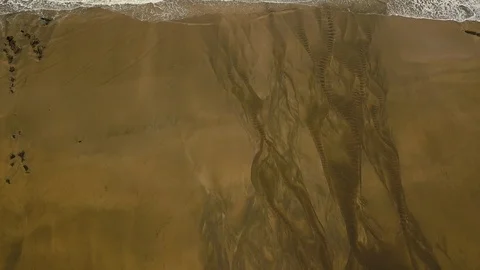 Drone footage of sea waves on the sandy beach. 動画素材 114583853