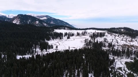 Drone footage of sharp road curves cutting through snow meadows. Stock Footage 311793754