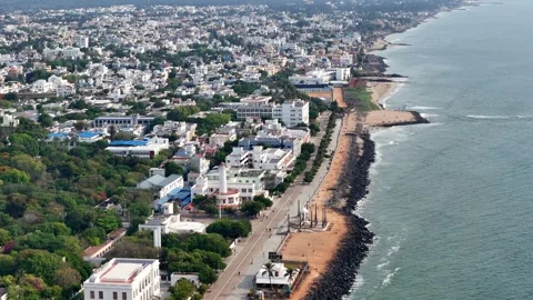 Drone footage showcases a developed beachfront. Modern architecture and a Stock Footage 314817586
