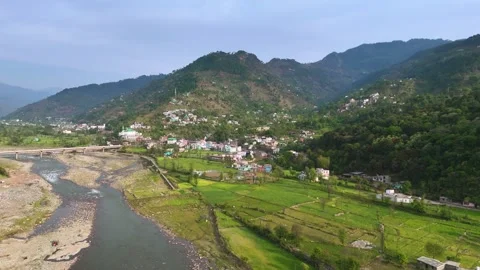 Drone footage showcasing the beautiful alignment of Poonch city, its bridge, and Stock Footage 311793486
