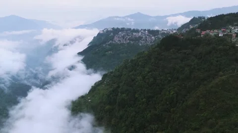 Drone footage showcasing a floating cityscape above clouds in Sikkim. Stock Footage 311370624