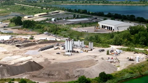Drone footage showcasing a large construction materials factory with storage Stock Footage 316284004