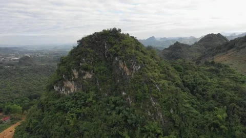 Drone footage showcasing the lush, forested mountains around Son La city in Stock Footage 346665657