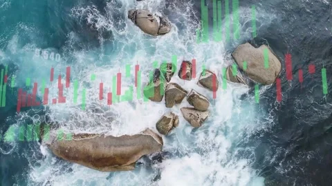 Drone footage showing candlestick overlay appearing from left, covering rocks to Stock Footage 333689890