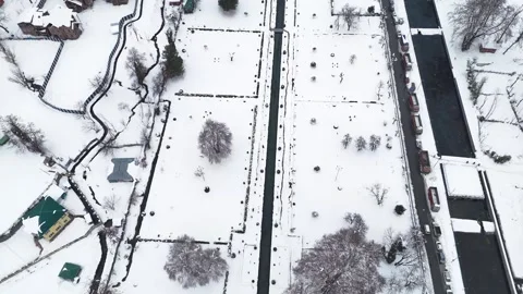 Drone footage showing Verinag spring carving its way through the quiet winter Stock Footage 311129341