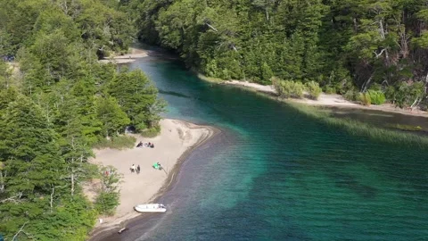 Drone footage shows a pristine waters lake beach. Glacier fresh waters Stock Footage 256183418