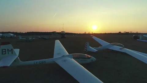 Drone footage slow fly through the Glider Sailplane Beautiful Sunset Stock Footage 74506791