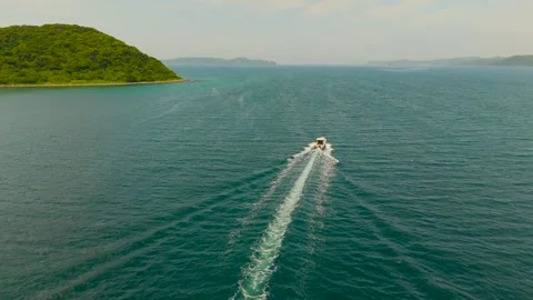Drone Footage of a Small Boat Sailing Across the Sea Stock Footage 337730854
