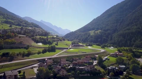 Drone footage of a small town surrounded by mountains in Italy (4K) Stock Footage 189365220