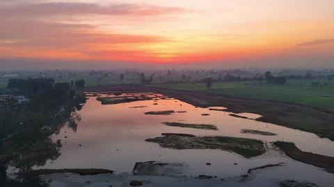 Drone footage of soft golden reflections across peaceful wetland waters. Stock Footage 310937404