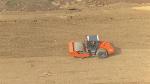 Drone footage of steamroller earthwork Stock Footage 158635628