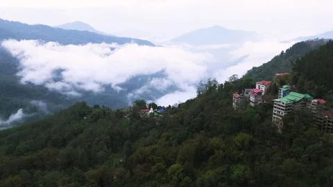 Drone footage of a stupa emerging from layers of white clouds. Stock Footage 311370683