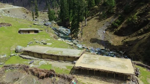 Drone footage of temporary nomadic settlements nestled in the serene green Stock Footage 311793370