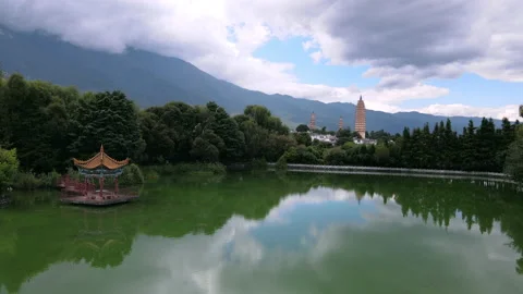 Drone footage of Three pagodas reflection pool park in Dali Yunnan China Stock Footage 150073210