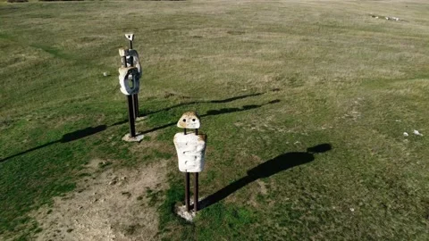 Drone footage of unusual monuments called Human Comedy in a field in Hungary Stock Footage 225677377