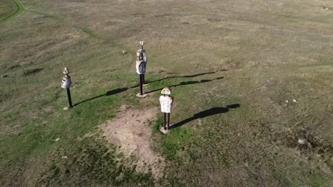 Drone footage of unusual monuments called Human Comedy in a field in Hungary Stock Footage 225677568