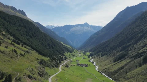 A drone footage of a valley between high mountains in Switzerland. Stock Footage 271608964