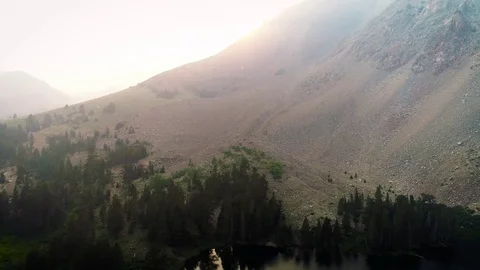 Drone footage of Very smoky steep rocky mountain near Yosemite Stock Footage
