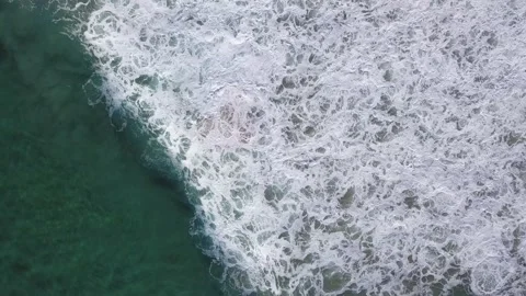 Drone Footage of waves hitting the beach. Stock Footage 132804793