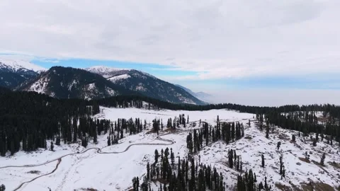 Drone footage of winding roads through snowy Dhoodhpathri. Stock Footage 311793683