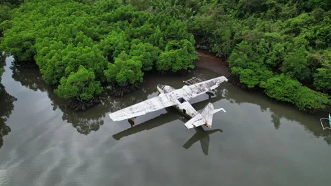 Drone footage of a wreck plane half submerged in Philippines Stockbeeldmateriaal 244472747